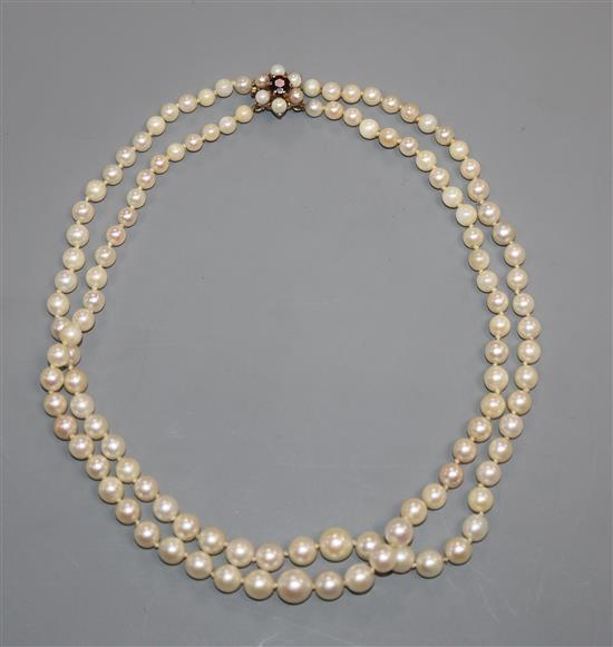 A double strand cultured pearl choker necklace with 9ct gem set clasp, 35cm.